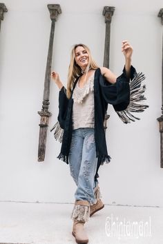 Alma Libra Black Boho Kimono Robe  This Fringe Kimono Jacket is a   unique mix of boho, American Indian and oriental elements into an   alchemical Chintamani masterpiece. Made out of soft pure linen, it comes   in raw unbleached silver-grey color or hand dyed delicate tints of   pink, cream and strong, wholesome black. Bohemian Long Sleeve Cardigan For Party, Chic Long Sleeve Cardigan For Festival, Fitted Bohemian Outerwear With Open Front, Fitted Long Cardigan For Festivals, Black Cardigan For Beach In Fall, Black Cardigan For Beach And Fall, Bohemian Fitted Cardigan For Party, Black Open Front Summer Outerwear, Black Open Front Outerwear For Summer