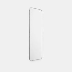 an empty white mirror hanging on the wall