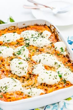 a casserole dish with mozzarella and parmesan cheese