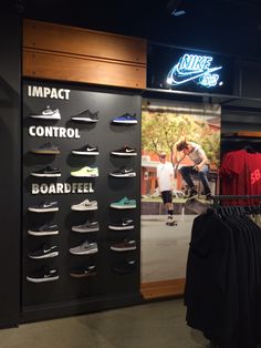 a display case with shoes and shirts on it