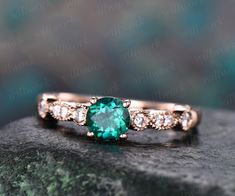 - Metal: Solid gold(10K/14K/18K white/yellow/rose gold),925 sterling silver,platinum available- Main Stone: 5mm round cut lab treated emerald- Accent Stone: natural conflict free diamonds,SI-H Clarity and Color- Can be personalized: Yes Vintage Emerald Engagement Ring, Ring Unique Design, Diamond Ring Unique, Emerald Ring Vintage, May Birthstone Rings, Green Emerald Ring, Rose Gold Diamond Ring, Unique Diamond Rings, Emerald Engagement