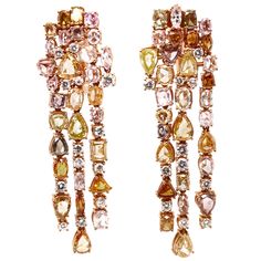 This 18K rose gold exclusive chandelier earrings are from our Divine collection. These chandelier earrings are a perfect combination of natural white diamonds in total of 1.22 Carat and fancy yellow diamonds in total of 7.51 Carat. The total metal weight is 21.04 Carat.They are 5.5 cm long. The piece of jewellery is a perfect addition to any special occasions. The Divine Collection has a unique blend of history, tradition and modern refinement inspired by the baroque period and its sophisticated style, providing extreme magnificence and prestige in all its pieces. As in the Baroque art, the jewellery is an elaborate and highly detailed work of art representing the company’s heritage and celebrating the history of the country where it all started, Italy. The Divine collection by VITALE 1913 Rose Gold Jewelry Outfit, Contemporary Jewelry Earrings, Gold Statement Jewelry, Art Deco Drop Earrings, Pink Gold Jewelry, Gold Diamond Drop Earrings, Yellow Diamond Earring, Baroque Period, Art Baroque