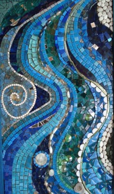 an artistic mosaic design with blue and green colors