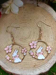 Pink Cherry Blossom and White Rabbit Japanese Anime Style Kawaii Earrings. Follow The Blossoms and The white rabbit. This year is the year of rabbit! Celebrate in style with these beautiful enamelled earrings.  Available hooks are Nickel-free iron and gold-plated Sterling Silver.