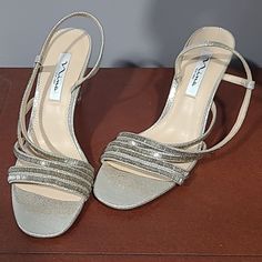 Have 3 1/2 Inch Heels. Very Beautiful Dress Heels. Can Also Be Worn To Dress Up Jeans. Chic Silver Heels For Dinner, Silver Heels For Dinner, Silver Heels For Formal Party Season, Elegant Silver Heels For Dinner, Silver Holiday Heels For Evening, Silver Heels For Evening Holiday, Silver Heels For Evening Holiday Events, Silver Holiday Heels For Cocktail, Silver Heels For Cocktail Holiday