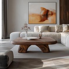 a living room with white couches and a wooden coffee table in the center area