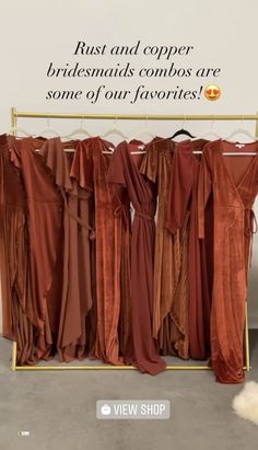 the bridesmaids'dresses are lined up on a rack in front of a sign that says, just and copper bridal