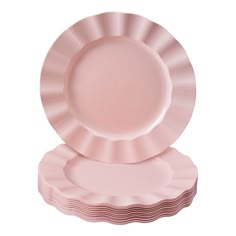 pink plates stacked on top of each other