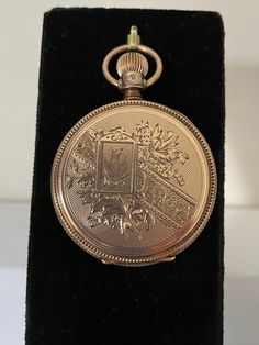 1885 antique solid 14 kt gold hunt case Elgin pocket watch. This watch is a size 8 with fancy engravings on the front and back there is a large letter N engraved on the front cover. This stunning watch is in good working condition and features a lever set style for setting the time where you must pull the lever out on the dial for the hand to move freely then push it back in place after setting the time. The porcelain dial features a sunken seconds at the 6 o'clock, the dial is pristine without cracks or hairlines simply says Elgin. The case features a textures center section easy to grip for opening and closing the case. Victorian Engraved Gold Watches, Victorian Engraved Watches For Formal Occasions, Antique Medallion Pocket Watch For Formal Occasions, Antique Gold Watch For Collectors, Antique Gold Collectible Watch, Antique Gold Watches For Collectors, Victorian Medallion Pocket Watch For Formal Occasions, Engraved Antique Gold Pocket Watch For Formal Occasions, Gold Victorian Style Pocket Watch For Formal Occasions