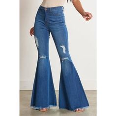 A pair of exaggerated, high-rise flare jeans featuring a front whiskered wash, open distressed knee detail, classic 5-pocket construction, frayed raw hem, and a zip-fly closure. -Rise: 11" Inseam: 33" -Model is 5'8" and wearing a size 3 -True to size Clothing Capsule, High Rise Flare Jeans, Western Style Outfits, Flare Denim Jeans, Denim Flares, Western Style, Style Outfits, Western Fashion, Bell Bottom Jeans