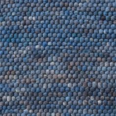 an area rug with blue and gray colors