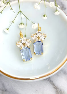 "These elegant Blue Aquamarine Crystal Drop Earrings are the perfect addition to your jewelry collection. The aquamarine stone gives off a beautiful blue color. The drop design makes these earrings great for casual or dressy everyday wear and can be worn casually or with a great outfit for a night out on the town. MATCHING NECKLACE:  https://www.etsy.com/iloniti//listing/1612316349 Details :  ● Materials- High-quality 1-micron thick Gold plating over brass, High-Quality SW Austrian Crystals  ● Lever Back - Hooks ●Size 34 mm x 10mm (1.3\" x 0.39\") ● Weight 2.9 g  (0.10 oz ) ● Stones are handsets in secure prongs ● Nickel Lead-Free ● Bridal - Bridesmaid - Bulk Order Discounts Available Please contact Me♥ ● Arrives in our signature Petite Delights by Ilona Rubin® Box.   Sent By Registered In Drop Bridal Earrings, Inexpensive Jewelry, Blue Drop Earrings, Bridal Earrings Drop, Light Sapphire, Aquamarine Crystal, Jewelry Lookbook, Crystal Drop Earrings, Crystal Drop