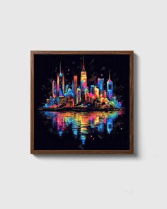 a colorful cityscape is reflected in the water on a black background with wooden frame