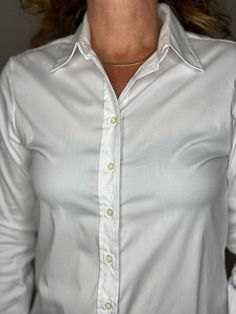 Our perfect fit cotton stretch button down. The Shirt reimagined for the perfect fit – powered by No Gape® button technology. Bye bye blouse gape, Hello The Shirt. Patented and designed by Rochelle Behrens to eliminate blouse gape. 75% Cotton, 20% Nylon, 5% Spandex Made in Portugal Powered by No Gape® button technology The Essentials Shirt runs a bit tailored at the waist, chest and back. For a contemporary fit, order true size. For a blousier fit, size up. S - Sleeve length 24, length 26.5M - S Essentials Shirt, Icon Shirt, Service Women, Bye Bye, Ladies Boutique, The Shirt, Looks Great, Portugal, Perfect Fit