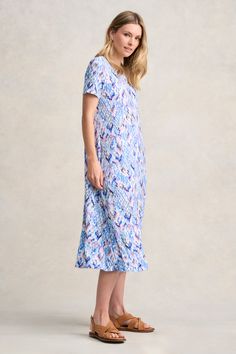 With a relaxed fit, our colourful Trapeze Jersey Dress is both easy to wear and to dress up or down depending on the occasion. Available in the joli Abstract Texture print, this midi-length beauty features a wide scoop neckline and comfortable summery short sleeve. Texture Print, Beauty Features, Spring Wear, Abstract Texture, Scarf Poncho, Work Wear Women, Wearing Clothes, Knitwear Cardigan, Sustainable Clothing