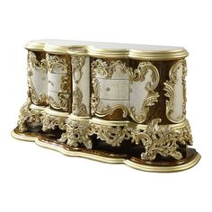 an ornately decorated gold and white cabinet