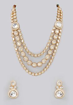 Dramatic 3 line necklace set in open setting with Kundan stones. Includes dainty matching earrings. Perfect for wedding and festive occasions. Composition : Mixed Metal Care: Avoid exposure to water and perfume. Store in dry plastic or fabric pouch. To clean, use a soft cloth to wipe the jewellery. Delivery : 6-8 weeks as the product is hand crafted. For more information and sizes please contact fabiliciousfashion@gmail.com or visit our Copenhagen studio. About the Designer : For brides-to-be an Indian Theme, Diamond Pendent, Kundan Necklace Set, Diamond Jewelry Store, Perfume Store, Fabric Pouch, Indian Wedding Wear, Kundan Necklace, Kundan Necklaces