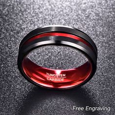 a black and red wedding band with the words,'tungten cardidie'on it