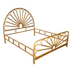 a golden metal bed frame with an intricate design