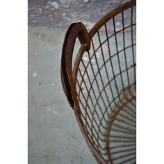 a close up of a metal basket on the ground