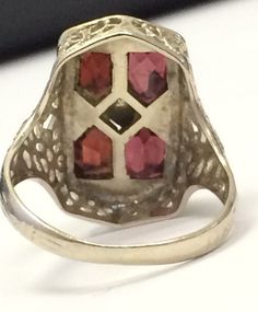 "VINTAGE 14K WHITE GOLD ANTIQUE GARNET ART DECO COCKTAIL RING BEAUTY!! Size 5.25 Each garnet measures approximately 5mm x 4mm Ring face measures 3/4\" high x 6/16\" wide. 3.6 grams One of the garnets are scratched across (see pics). Not cracked through. Shipped insured/delivery confirmation I guarantee item to be exactly as described and pictured." Antique Signet Ring With 17 Jewels For Anniversary, Antique 14k White Gold Jewelry, Vintage Emerald Cut Gemstone Rings, Vintage 14k White Gold Jewelry With Emerald Cut, Antique 14k Gold Birthstone Ring, Vintage 14k White Gold Jewelry, Vintage 14k White Gold Ring, Antique 14k Birthstone Ring For Anniversary, Estate 14k Gold Jewelry For Anniversary