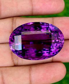 This listing is for a 100% Natural Amethyst originated from Brazil and it weighs 82.02carats. This Deep Purple, clean gemstone, is 33 X 23 X 17.5 mm in size. This is a gorgeously stunning Amethyst. Specially for those who love to Collect huge stones or Amethyst lovers. Brazilian Amethyst are known to be the most beautiful compared to others around the world. Rich deep purple is a show stopper. Perfect for a pendant or statement ring. Luxury Purple Amethyst Gemstones, Oval Amethyst Gemstones With Accents, Purple Oval Stone Jewelry, Oval Amethyst Gemstones With Gemstone Accents, Purple Oval Stones Jewelry, Purple Oval Jewelry With Stones, Luxury Purple Oval Gemstones, Purple Oval Gemstones With Accent Stones, Oval Purple Gemstones With Accent Stones