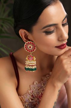 These jhumka earrings, based on gold plated silver alloy feature kundan set in a delightful floral pattern. The silver alloy base is embellished with kundan and shell pearls. These jhumkas are a great pick for wedding nights or any traditional occasion. These party wear gold plated jhumkas will make you look really beautiful and gorgeous. These jhumkas have a timeless style of design. Attention to detail is our utmost goal. The Look Is stunning and preciously Suitable For All Kinds Of Dressy Occ Luxury Red Jhumkas For Festivals, Red Cutdana Earrings For Navratri, Chandbali Danglers With Latkans For Puja, Navratri Anarkali Tilla Jhumkas, Navratri Anarkali Style Jhumkas With Tilla, Festive Tilla Drop Jhumkas, Anarkali Style Tilla Jhumkas For Navratri, Red Cutdana Earrings For Puja, Gold Jhumkas For Festive Occasion