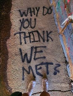 someone is standing on the sidewalk with their feet up and writing on the pavement that says, why do you think we mets?