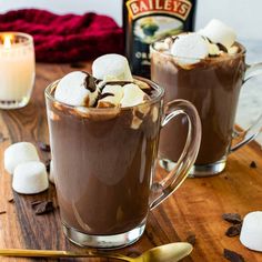 two mugs filled with hot chocolate and marshmallows