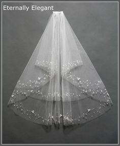 a white veil with flowers on it