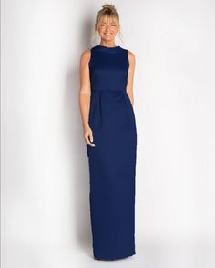 One of our most popular designs for Mother's of the Bride/Groom & Bridesmaids. A classic silhouette made in a luxe satin material with a natural sheen. Rolled collar detail on the front neck drapes down the back to a bra-friendly v. This dress waist line is at natural waist with front box pleats. Silhouette: SheathFit: Can run small due to no stretch (see size guide)Details: Rolled CollarClosure: Invisible ZipperFabric: Non-Stretch SatinCare: Dry Clean OnlyFully Lined: YesBra Friendly: Yes & fea Fitted Gown With Pleated Bodice For Formal Occasions, Sleek Gown With Satin Finish And Fitted Bodice, Sleek Satin Finish Gown With Fitted Bodice, Elegant Full-length Evening Dress With Ruched Bodice, Wedding Maxi Dress With Pleated Back And Fitted Bodice, Wedding Maxi Dress With Fitted Bodice And Pleated Back, Formal Floor-length Gown With Satin Lining, Sleek Satin Finish Gown For Wedding, Formal Satin Gown