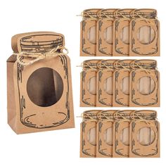 six mason jars with lids and twine string tied together in brown paper bags next to each other