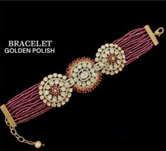 Enhance your accessory collection with this exquisite designer bracelet inspired by the renowned designer Sabyasachi. The bracelet is crafted with authentic moissanite stones and is perfect for adding glamour to any outfit. This jewellery set comes with a beautiful bracelet that is perfect for any occasion. The stones used in this bracelet are of high quality and are guaranteed to catch the eye. The bracelet is made from a durable material that will ensure it lasts for a long time. This set is p Designer Gold Bangle Bracelet For Wedding, Elegant Festive Bracelets For Festivals, Stone Work Bracelets As Festival Gifts, Silver Cutdana Bracelet For Formal Occasions, Formal Silver Bracelet With Cutdana, Elegant Adjustable Bangle For Diwali, Elegant Stone Work Bracelets For Festive Season, Elegant Hand Set Pearl Bracelet For Festive Occasions, Luxury Bracelets For Festivals As Gifts