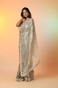 Radiate glamor on special occasions in this beautiful cream diamond applique work designer net saree. It comes with a matching saree blouse. Shop designer sarees in USA from Pure Elegance. Disclaimer: The actual product may vary slightly from the image. These are custom orders, hence expect slight variation in color, placement of the motif or buta. ESTIMATED DELIVERY Because this is a custom order, it would take about 4 weeks from the date of purchase. RETURN POLICY This product is a custom orde Fitted Cream Saree With Dupatta, Bollywood Style Cream Pre-draped Saree With Zari Work, Festive Cream Pre-draped Saree With Dupatta, Elegant Net Saree With Unstitched Blouse, Cream Chanderi Saree For Reception, Cream Semi-stitched Pre-draped Saree With Zari Work, Semi-stitched Cream Pre-draped Saree With Zari Work, Designer Cream Pre-draped Saree With Zari Work, Cream Saree Blouse Piece With Sheer Dupatta