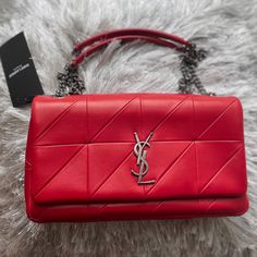 Saint Laurent Jamie "Carr Rive Gauche" In Red Lambskin Leather, Black Lining With Gunmetal Color Hardware. Can Be Worn As A Crossbody Or Shoulder Bag. Exterior Features: Flap With Hidden Snap Closure, Slide Chain Straps With Leather Strip For Shoulder And Front Ysl Logo. Interior Features: 3 Card Slots, 1 Zip Compartment And 1 Patch Pocket. Includes: Dust Bag Ysl Mini Lou Bag, Ysl Cushion, Bags Ysl, Saint Laurent Purse, Chloe Brown, Saint Laurent Bags, Ysl Logo, Drawstring Bucket Bag, Yves Saint Laurent Bags