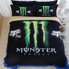 a bed with monster energy comforters and pillows