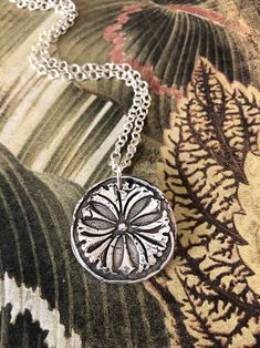 This a wax seal stamp of a ginkgo leaf into pure silver (.999). It symbolizes being RESILIENT. Each seal is hand crafted of fine silver (.999) Sterling silver is (.925). Each one is unique as the process is done by hand and not a press. The one you order will look as close to the picture as possible but no two are exactly alike. This is a process of many steps involving forming, drying, firing, hand polishing and the final patina gives and antique look. If you want the silver to be shiny, I can Silver Etched Necklace With Flower Pendant, Silver Etched Nature-inspired Necklaces, Nature-inspired Silver Etched Necklaces, Being Resilient, Seal Jewelry, Wax Seal Jewelry, Ginkgo Leaf, Jewelry Techniques, Wax Seal Stamp