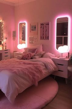 a bedroom with pink lights on the walls and bed in front of a large mirror