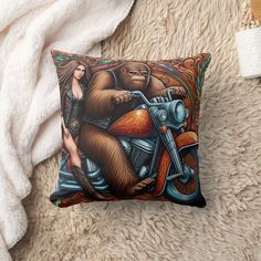 there is a pillow with a bear on it and a woman riding a motorcycle in the background