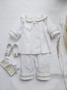 "Lovely Baptism outfit set for a Baby Boy made from soft pure polished cotton.  It looks nice and glitters elegantly. Christening Outfit Set, color white, decorated with gold embroidery.  Embroidery of Cross or JHS, as well as a kind of Cross, could be changed upon request.  The thread color of the embroidery could be: gold, silver, white, ivory, blue Booties, hat, blanket, hair bag, bib could be included in the SET option.  Personalization is available on each item.  If the christening will tak