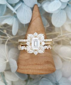 an engagement ring on top of a piece of wood