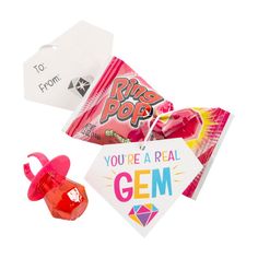 a candy bag with some candies in it and a sign that says, you're a real gen