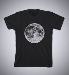 a black t - shirt with the moon printed on it