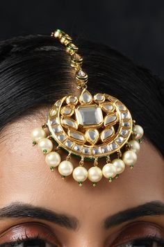 Elegance of timeless polki combined with high grade shell pearls.This delicate mangtikka is set in copper alloy and plated with 22k gold. Mangtikka - Top size - 5 cm STYLE TIP - This one is for effortless styling with your traditional wear. Team this with anything traditional for easy peasy classic dressing. Handcrafted in Jammu and Kashmir. Paisley Pop travels the depths of India to learn techniques and crafts from deep down the local markets and villages. We give utmost importance to our quali Luxury Festive Tikka For Diwali, Luxury Tikka With Latkans For Festivals, Luxury Bollywood Style Tikka For Festivals, Luxury Tikka For Diwali Festive, Luxury Meenakari Tikka For Celebration, Luxury Tilla Tikka For Celebration, Luxury Elegant Tikka For Festivals, Gold Fusion Style Tikka With Meenakari, Gold Fusion Tikka With Meenakari