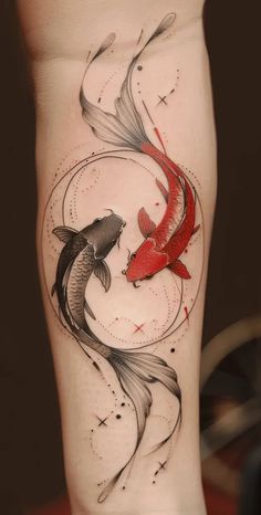 a woman's leg with two koi fish tattoo on it