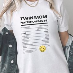 Twin Mom Nutrition Facts ABOUT THE SHIRT: This classic unisex jersey short sleeve tee fits like a well-loved favorite. Soft cotton and quality print these t-shirts have-ribbed knit collars to bolster shaping. The shoulders have taping for better fit over time. Dual side seams hold the garment's shape for longer. : 100% Airlume combed and ringspun cotton (fiber content may vary for different colors) .: Tear away label .: Runs true to size Twin mom t-shirt, twins t-shirt, twin mama tee, twin jokes Funny Short Sleeve Tops For Mother's Day, Family Funny Print Graphic Tee, Fun Family T-shirt With Funny Text, Fun T-shirt With Name Print For Mother's Day, Fun Custom Print T-shirt For Mother's Day, Fun Mother's Day T-shirt With Text Print, Fun Mother's Day T-shirt With Name Print, Funny Pre-shrunk Tops For Mother's Day, Funny Text Print T-shirt For Mother's Day