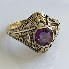 Details: Victorian 14K gold Art Deco amethyst ring circa 1930's. Beautiful deco design, with leaf inspired pattern. The lovely amethyst measures 6.7mm x 6.7mm, and sits about 5.5mm from the finger. The setting measures 15.4mm from top to bottom. The ring is in excellent condition. Please ask all necessary questions prior to placing an order. Measurements: The size is 7 US and can be sized for a fee. Condition: The overall all condition of this ring is excellent condition and the stone is securel Classic Amethyst Ring Stamped 14k, Elegant Purple Amethyst Signet Ring, Antique 14k Gold Amethyst Ring, Heirloom Amethyst Birthstone Ring, Art Deco Gold Ruby Ring, Formal 14k Stamped Amethyst Ring, Art Deco Yellow Gold Amethyst Ring, Art Deco Amethyst Ring In Yellow Gold, Art Deco Oval Purple Amethyst Ring