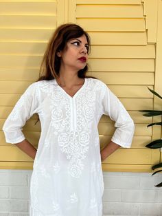 Introducing our White Women's Chikankari Kurta Long, a stunning fusion of style and comfort designed for warm weather elegance. This airy and lightweight Indian cotton white kaftan dress is your perfect companion on scorching summer days. What's more, the softness of this cotton kurta only deepens with each wash, ensuring a delightful wearing experience. This hand-embroidered beauty isn't just a piece of clothing; it's an ideal choice for functions and parties. Whether you're aiming for a classi White V-neck Kaftan For Spring, White Free Size Traditional Kurta, Free Size White Traditional Kurta, Traditional White Free Size Kurta, Spring V-neck Kurta With Chikankari Embroidery, V-neck Kurta With Chikankari Embroidery For Spring, White Straight Kurta Tunic For Spring, Casual V-neck Kurta For Summer, White V-neck Kurta For Spring