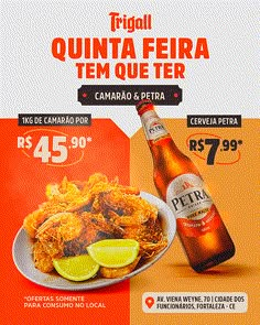 an advertisement for a beer and some food on a plate with lemon wedges next to it