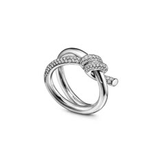 The entwined ends of Tiffany Knot’s signature motif symbolize the power of connections between people. Balancing strength and elegance, each Tiffany Knot design is a complex feat of craftsmanship. This ring is crafted with white gold and polished by hand for high shine. Each round brilliant diamond—specifically chosen to meet Tiffany’s high standards—is hand set at precise angles to maximize brilliance. Wear this ring on its own or partnered with classic silhouettes for an unexpected pairing. 18 Tiffany And Co Knot Ring, Tiffany Knot Ring, Diamond Ring Tiffany, Tiffany Knot, Tiffany Diamond Ring, Tiffany Ring, Tiffany Co Rings, Tiffany Rings, Symbol Of Life